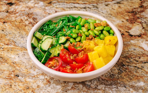 Preview: Fresh vegetable bowl with vibrant greens and fruits for healthy eating