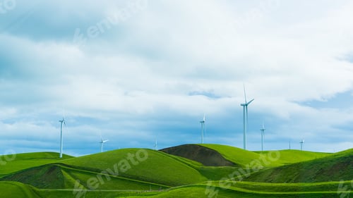 Preview: Beautiful view of wind turbines in the field against a cloudy sky, power generation wind farm