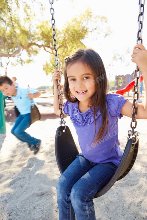 Preview: Boy And Girl Playing On Swing In Park
