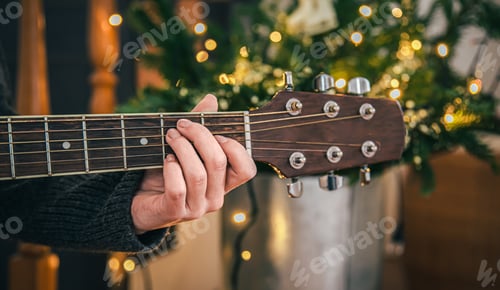 Preview: Close up, female hands playing the guitar.