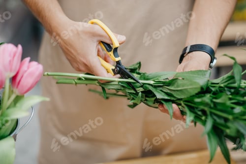 Preview: Gardener, owner, seller makes bouquet for clients online ordering
