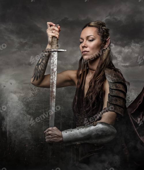 Preview: Sexy brunette female in a war queen costume.