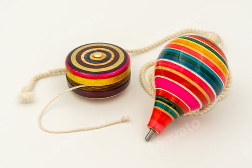 Preview: Colorful yo-yo and trompo on a white background