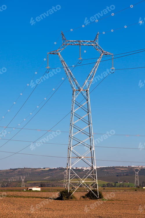 Preview: Electricity Power Pylons against Bright Blue Sky
