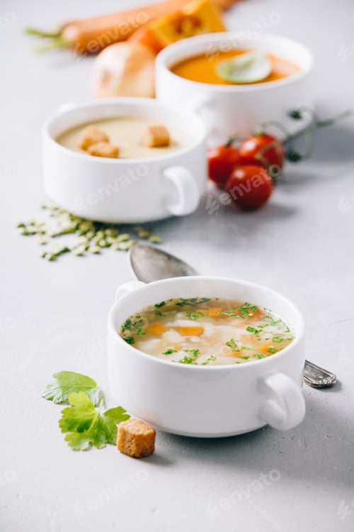 Preview: Pea, tomato, vegetable soups and ingredients on concrete background