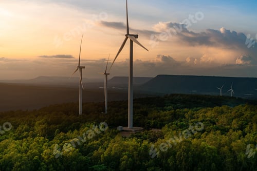 Preview: Wind Turbines On Forest Hillside At Sunset
