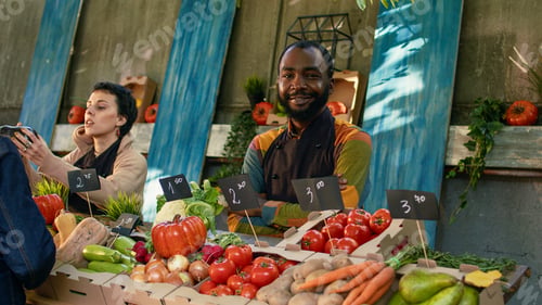 Preview: Portrait male farmer working at farmers market stand