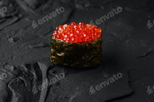 Preview: Exquisite salmon roe sushi on dark slate