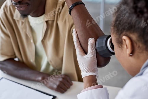Preview: Dermatologist Examining Skin using Dermatoscope