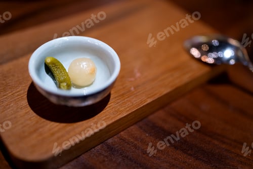 Preview: Close-up cucumber pickle and onion on a plate