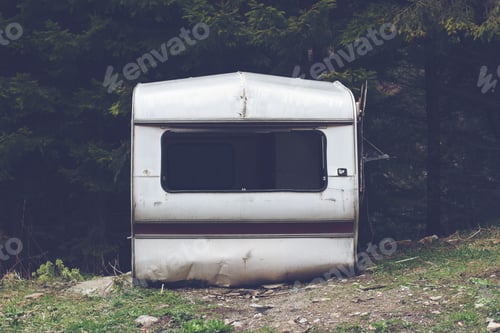 Preview: damaged car trailer in the woods