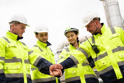 Preview: Group of engineer stacking hand in unity, teamwork and collaboration at construction site