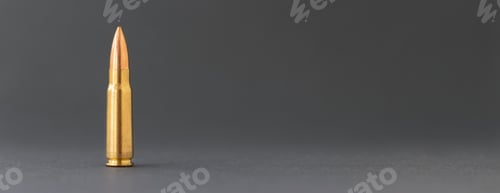Preview: Bullet on gray background. Cartridge 7.62 caliber for Kalashnikov assault rifle