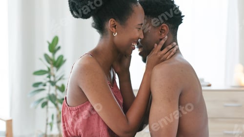 Preview: Black couple, laugh and sex intimacy kissing, bonding and enjoying foreplay in the bedroom at home.