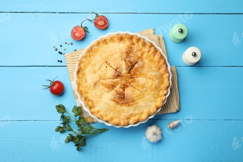 Preview: Tasty homemade pie, products and spices on light blue wooden table, flat lay