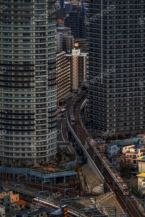 Preview: Top view or aerial view of Tokyo Cityscape skyscraper with trains running over Railroad tracks