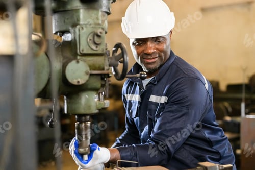Preview: Portrait of happy male industrial worker in white hard hat working