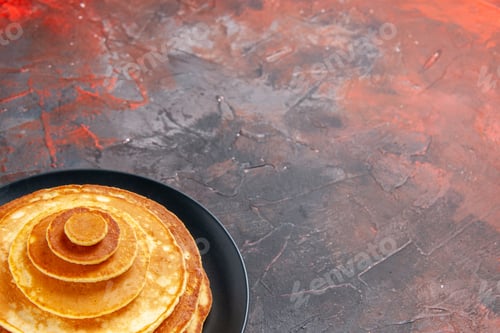 Preview: Horizontal view of easy tasty pancakes in a black plate