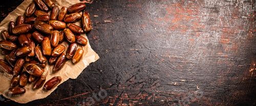 Preview: A pile of dates on paper on the table.