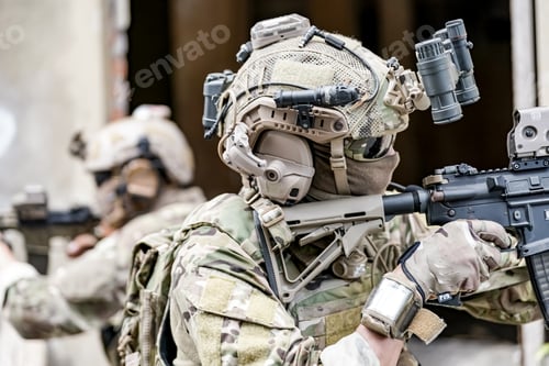 Preview: Soldier in full US MARSOC armed with assault rifle run through the abandoned building. Military