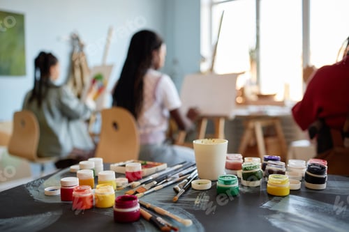 Preview: Multiethnic Women Painting on Canvas during Art Class in Studio