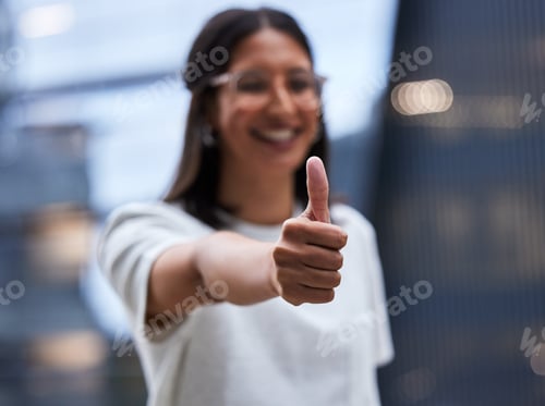 Preview: Shot of a young businesswoman Showing thumbs up while standing outside the office