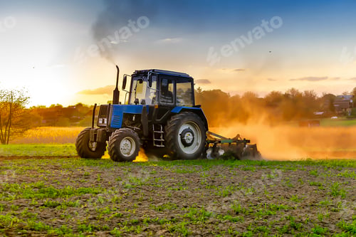 Preview: blue tractor machinery plowing agricultural field cultivating,soil tillage seeding plants,crops