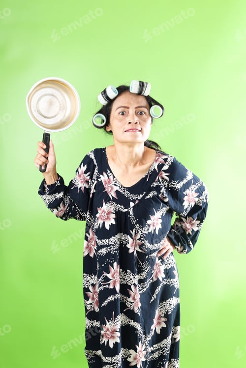 Preview: Angry Asian House Maid Wearing Daster Standing While Holding Noodle Pan