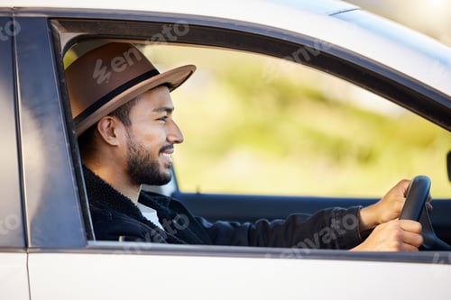 Preview: Roads were made for journeys, not destinations. Shot of a young man driving his car.
