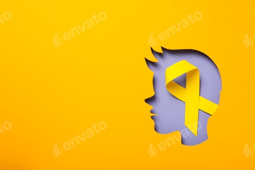 Preview: A child's head made of paper with a yellow ribbon