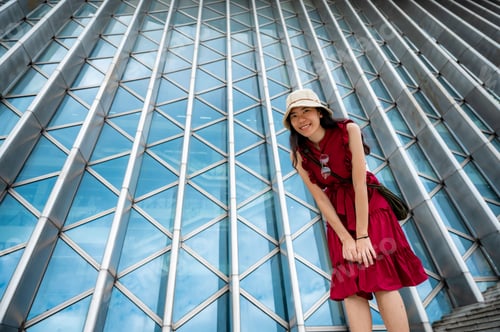 Preview: Asian woman in red dress at modern building, female girl with urban city lifestyle