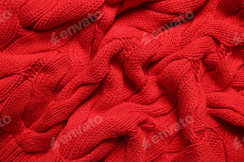Preview: Texture of soft red knitted fabric as background, top view