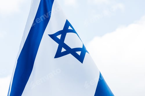 Preview: national israel flag with star of david against blue sky
