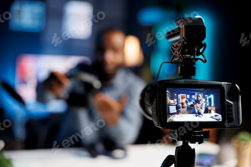 Preview: Man Recording Himself Using Video Camera at Home