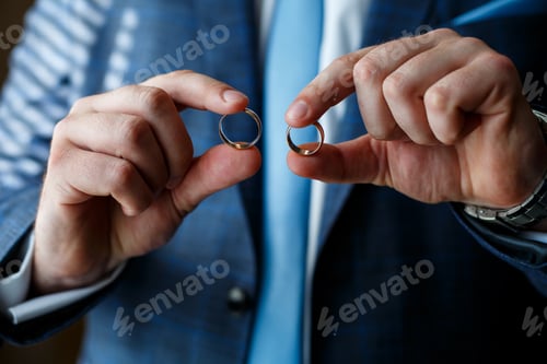 Preview: Golden wedding rings for newlyweds on their wedding day