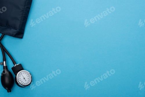 Preview: top view of sphygmomanometer on blue background