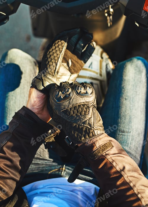 Preview: I never ride without my gloves. Cropped shot of an unrecognizable man riding a motorbike.