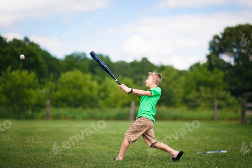 Preview: Boy playing baseball on field