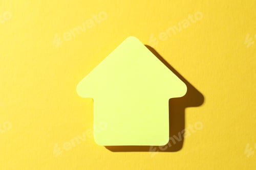 Preview: One paper arrow on yellow background, top view