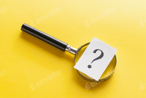 Preview: Magnifying glass with question mark on yellow