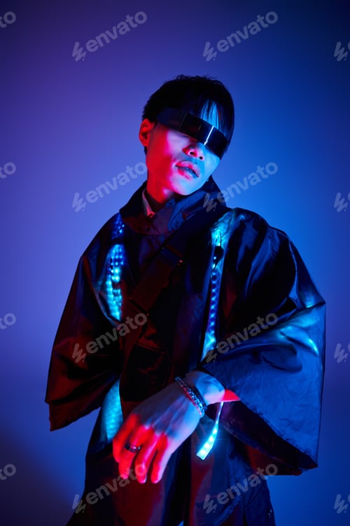 Preview: Stylish young man exuding confidence in a vibrant, colorful setting with striking fashion