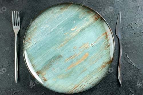 Preview: top view cyan round plate fork and knife on dark background