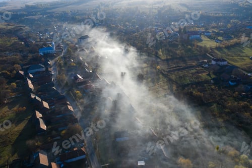 Preview: High angle view of morning haze over village in Transylvania