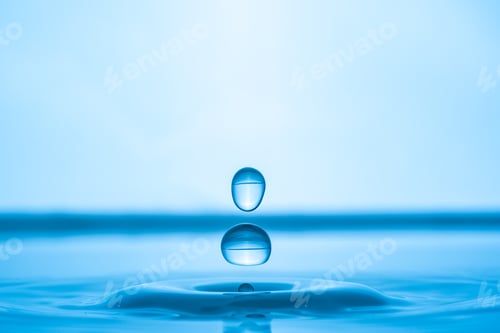 Preview: Water drop splashing into blue water surface