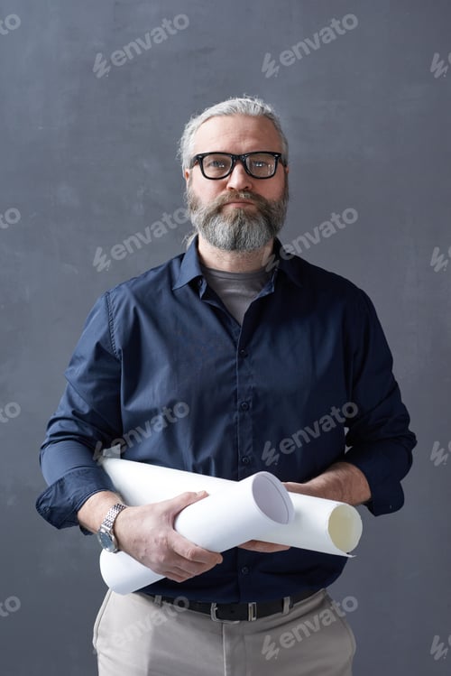 Preview: Experienced architect with blueprint