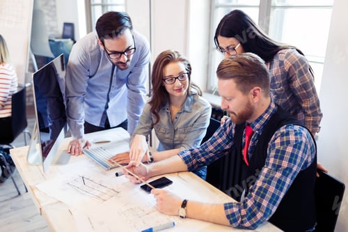 Preview: Picture of young architects discussing in office