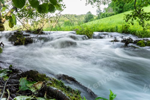 Preview: Beautiful scenery of a river in a green land