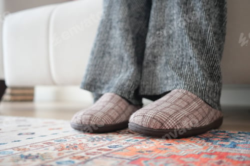 Preview: Cozy afternoon at home with comfortable slippers on a patterned rug