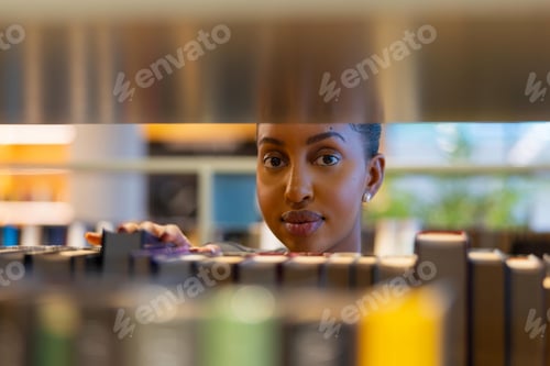 Preview: Focused Student Browsing Library Books