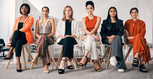 Preview: Shot of a group of businesswomen sitting in a row in an office at work